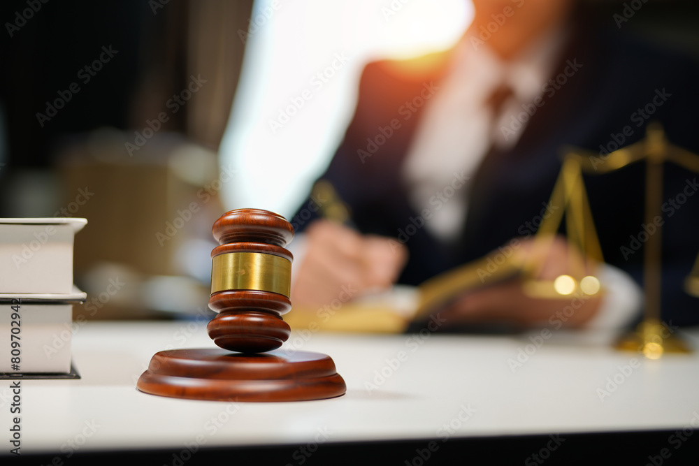 judge on wooden table And experienced lawyers meet with clients and give advice behind the scenes. legal services legal consulting concept judge on wooden table And experienced lawyers meet with clients and give advice behind the scenes. legal services legal consulting concept