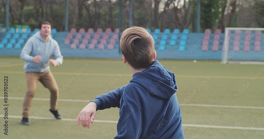 Father Playing Rugby Ball with His Son Outdoors, Dad Teaching the Boy to Play American Football. Family sports weekend. 4K video. Father Playing Rugby Ball with His Son Outdoors, Dad Teaching the Boy to Play American Football. Family sports weekend. 4K video.