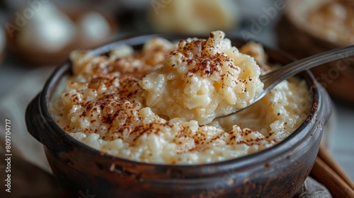 comfort food, creamy rice pudding being scooped from a bowl, the perfect comfort food on a rainy day, creating a cozy atmosphere
