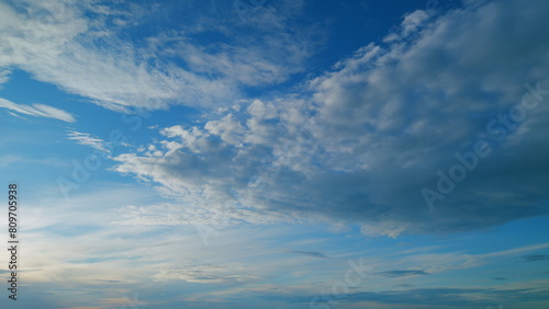 Fototapeta Naklejka Na Ścianę i Meble -  Warm colors of sky and clouds at sunset. Cloud nature background. Timelapse.