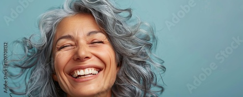 Beautiful gorgeous 50s mid age beautiful elderly senior model woman with grey hair laughing and smiling. Mature old lady close up portrait. Healthy face skin care beauty, skincare cosmetics, dental. photo