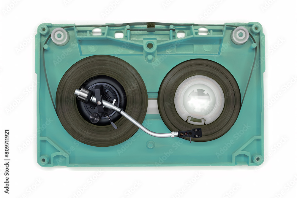 Fototapeta premium Turntable arm on old audio cassette tape open