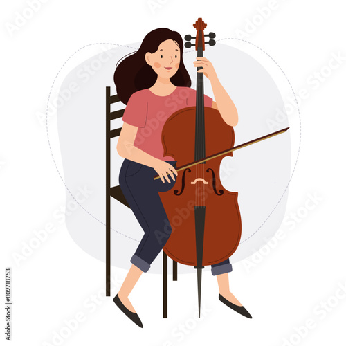 The girl plays the cello. A woman musician with a cello.
