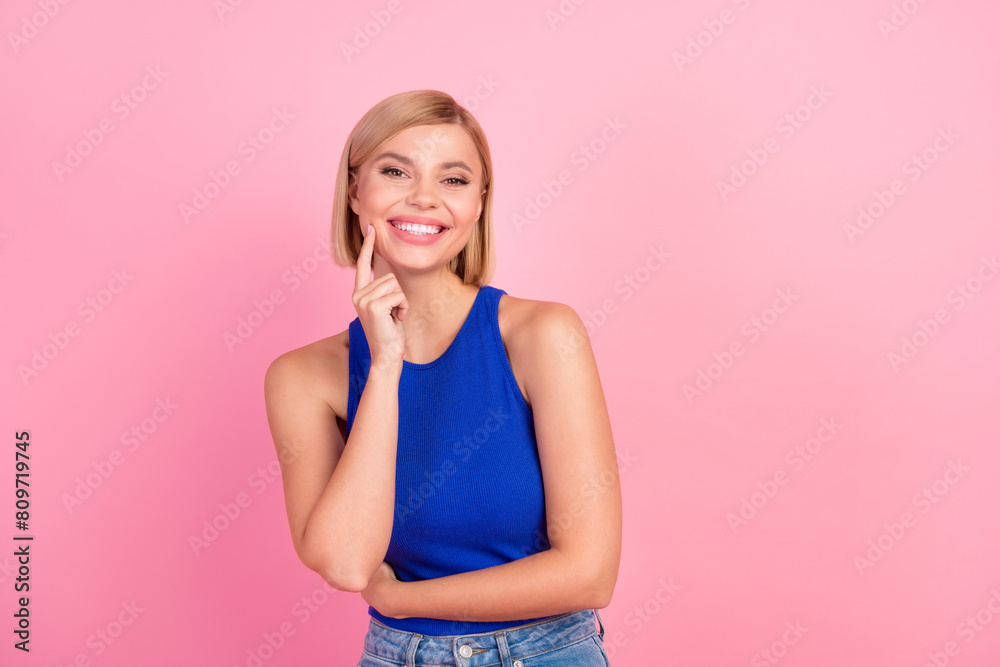 Portrait of nice girl think empty space wear blue top isolated on pink color background