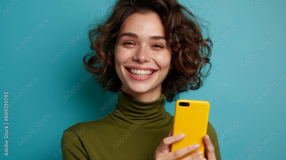 Woman Smiling Holding Smartphone Woman Smiling Holding Smartphone