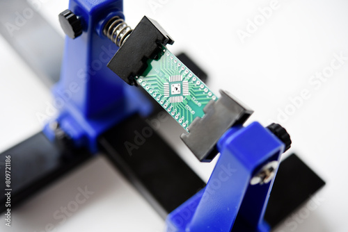 A printed circuit board for trace elements. Radio electronics. A holder for printed circuit boards.