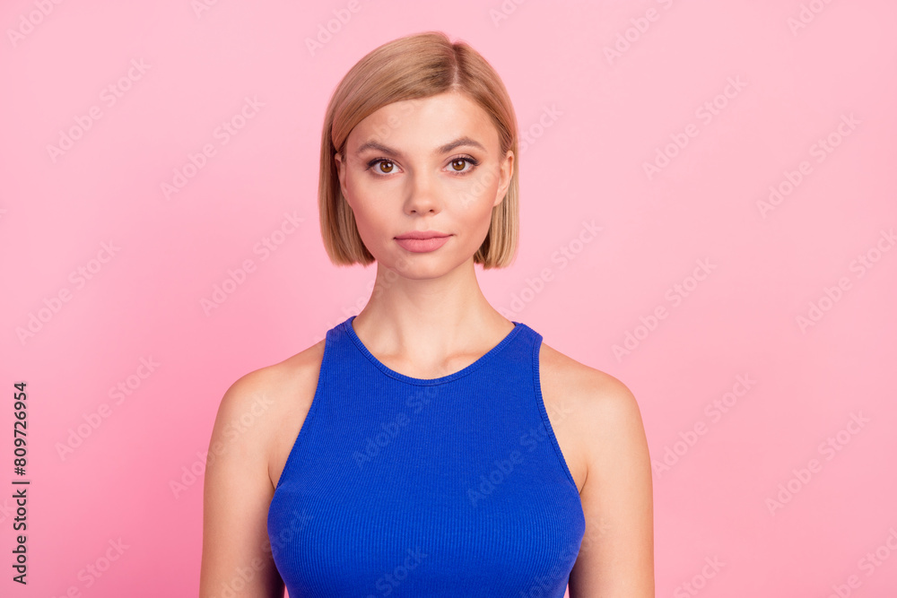 Obraz premium Photo of pretty young woman calm face empty space wear blue top isolated on pink color background