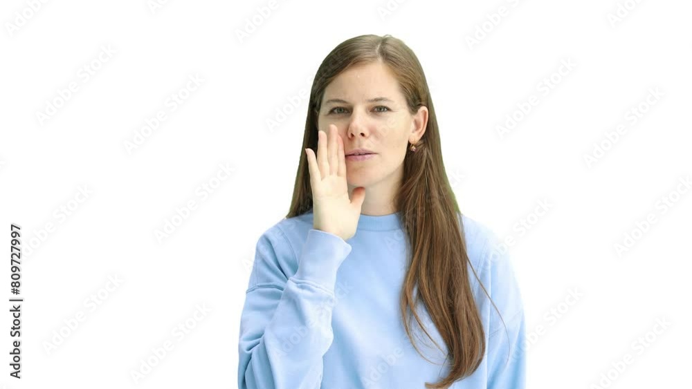 A woman, close-up, on a white background, tells a secret A woman, close-up, on a white background, tells a secret