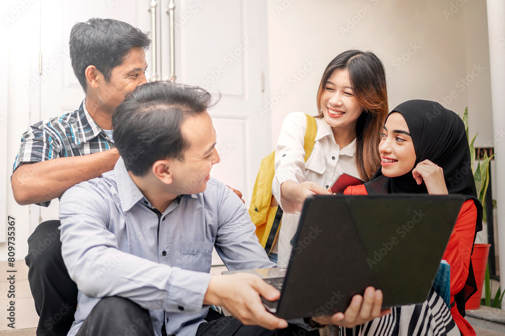 Portrait of multiethnic business colleagues discussing a business project plan during a meeting Portrait of multiethnic business colleagues discussing a business project plan during a meeting