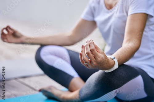 Meditation  calm and hands of woman with lotus pose in garden for mindfulness and spiritual wellness at home. Relax  health and female person with yoga exercise for balance at outdoor patio by house.