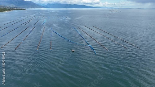 Aerial View Of Offshore Aquaculture In Puerto Montt Bay. Orbit Motion Shot photo