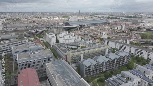 Euroatlanitic city buildings area in Bordeaux France with The St. Jean Belcier train station near Garonne river, Aerial pan left shot photo