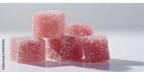 Closeup side view of four, cube shaped pink gummies, advertising product shot, in a pile, lit perfectly, fancy product shot, white background. (ID: 809746302)