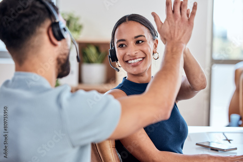 High five, happy and woman with headset in workplace for good job, success and pride for telemarketing. Colleagues, man and female business person with smile in office for teamwork and partnership