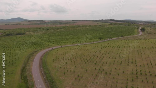 sports car driving down the road, drone footage