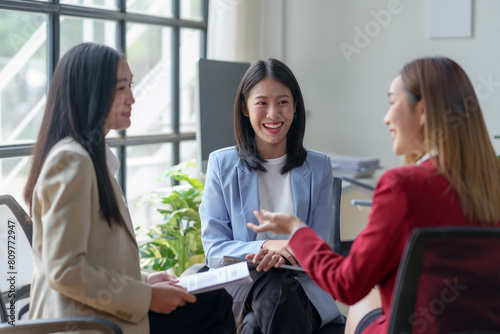 Asian business woman talk, consult, discuss working with new startup project idea presentation analyze plan marketing and investment in the office.