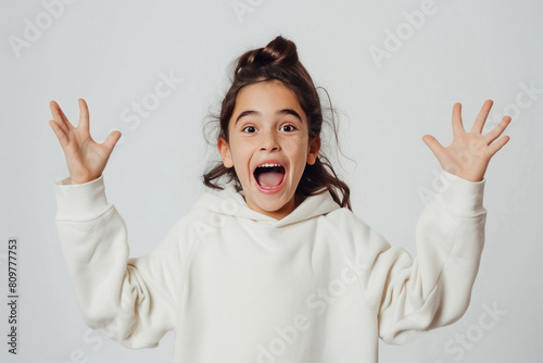 Cute little girl child giving shocking and fear expression photo