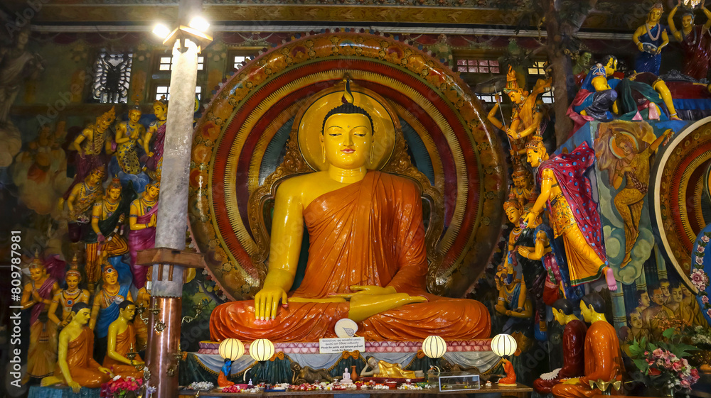 Statue of Lord Buddha inside Gangaramaya Temple, Colombo, Sri Lanka.