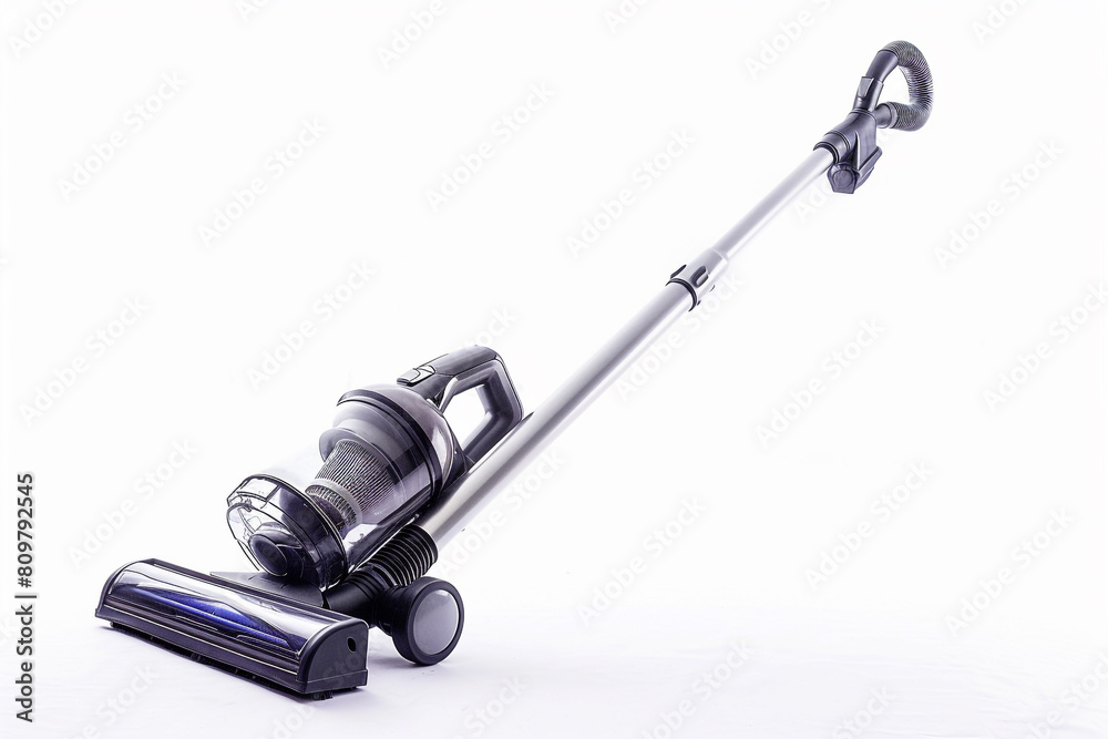 A lightweight stick vacuum cleaner with a corded design and large dust cup capacity for hassle-free cleaning isolated on a solid white background. A lightweight stick vacuum cleaner with a corded design and large dust cup capacity for hassle-free cleaning isolated on a solid white background.