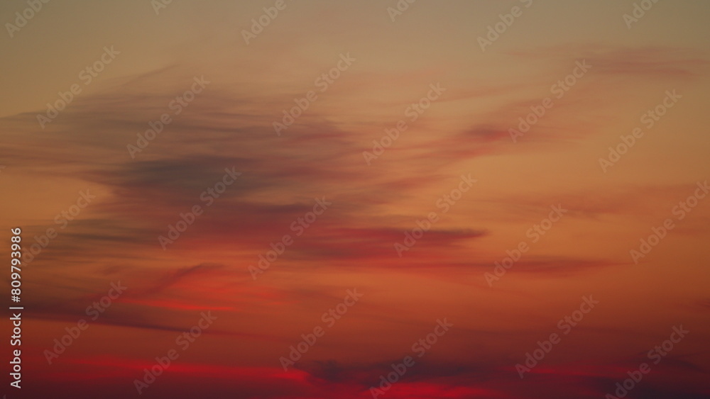 Beautiful colorful colored clouds in the summer sky. Multicolored bright sky at sunset. Pan.