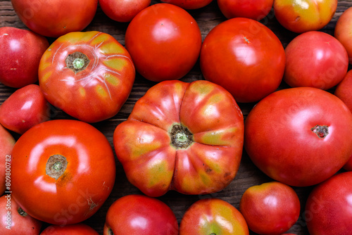 Homegrown red tomatoes background. Bio organic vegetables on farmer market. Farm fresh vegetable background. Food concept. © alicja neumiler