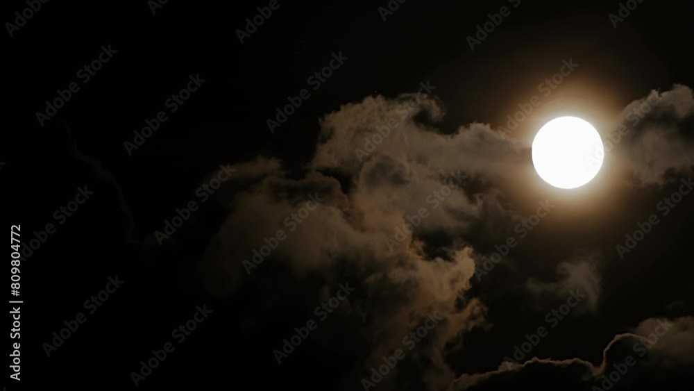 Person exhales smoke in the darkness, creating a cloudlike effect Person exhales smoke in the darkness, creating a cloudlike effect