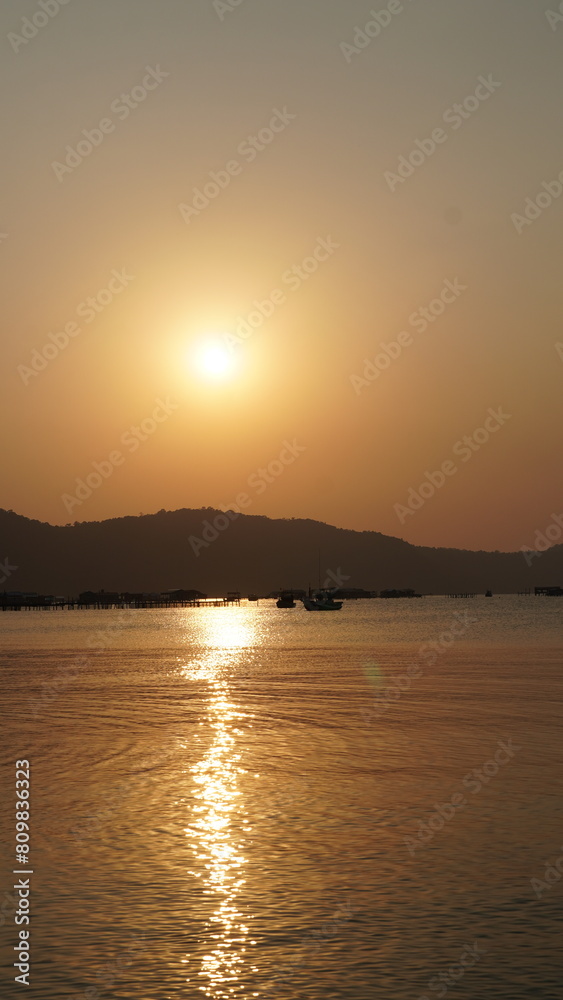 Naklejka premium Phu Quoc Vietnam beach view to sunset ocean with mountains