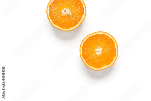 Halves of an orange on a white background. View from above.