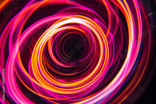 Hypnotic neon vortex with swirling pink and orange patterns. Mesmerizing art on black background.