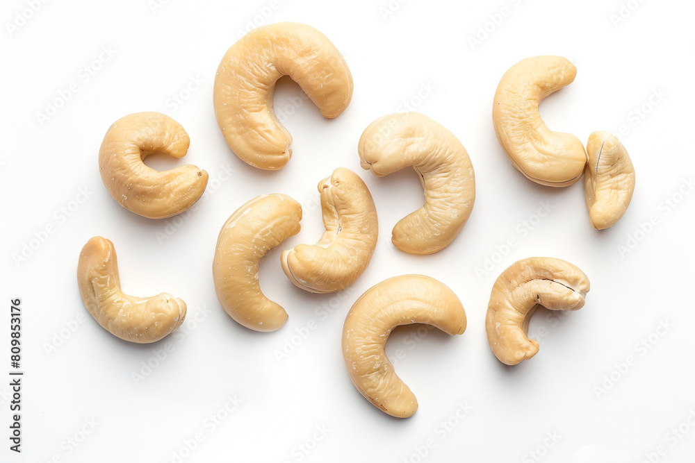 a group of cashews on a white surface a group of cashews on a white surface