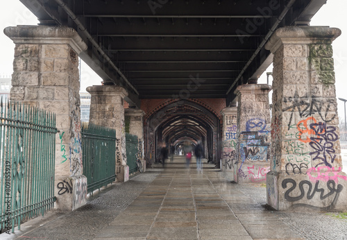 View of Under Oberbaumbrcke or Oberbaum Bridge over the Spree River in Berlin. East arcades, One of the most important bridges in Berlin. Space for text, Selective focus. photo