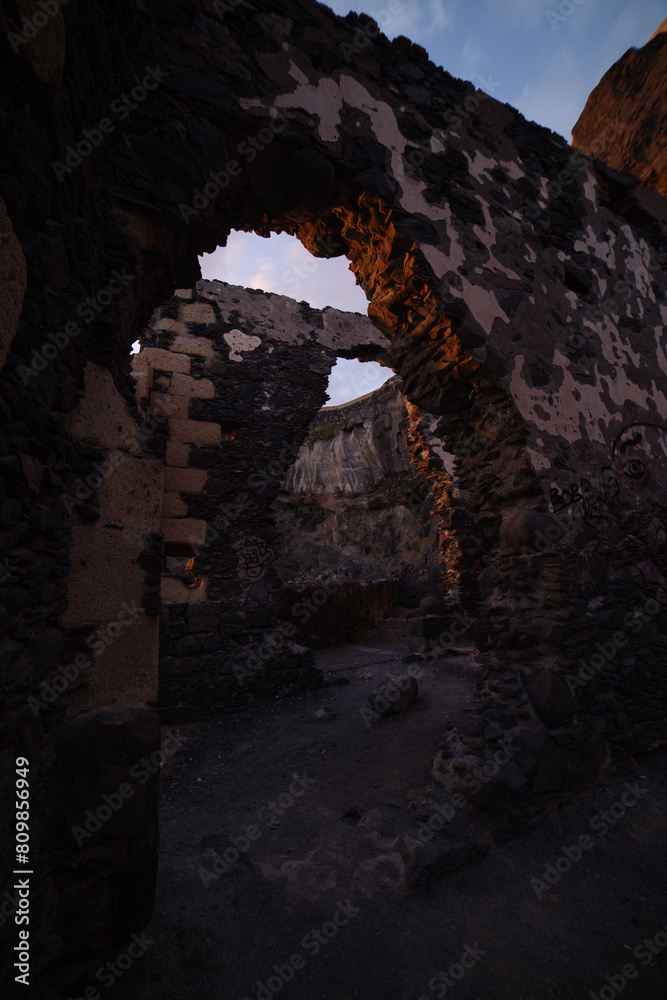 Pumping station ruins at the seashore at the sunset