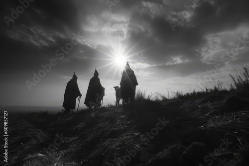 Three wise men following a bright star, leading them to the nativity scene photo