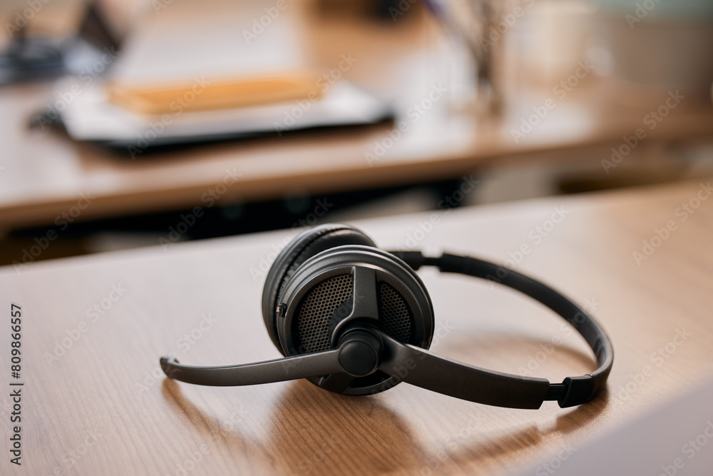 Office, call center and headset on desk for customer support, online consulting and CRM business. Empty workplace, service and microphone on table for telemarketing, digital agency and contact Office, call center and headset on desk for customer support, online consulting and CRM business. Empty workplace, service and microphone on table for telemarketing, digital agency and contact