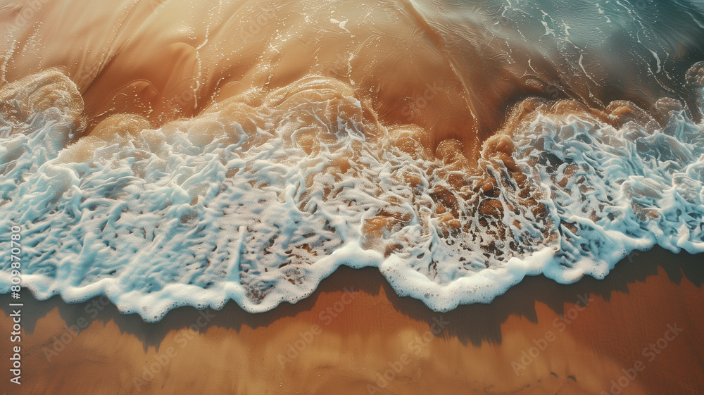 Aerial view of sandy beach with waves