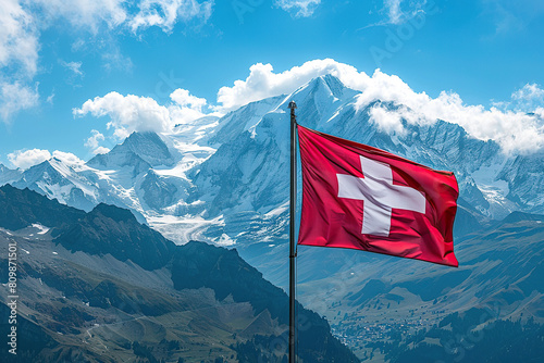 Fotografie Swiss flag on a background of beautiful mountains on a sunny day