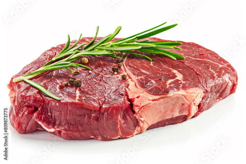 a piece of steak with a sprig of rosemary