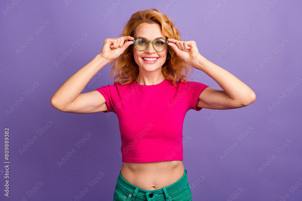 Photo of stunning adorable nice woman wear trendy pink clothes hand hold sunglass isolated on purple color background Photo of stunning adorable nice woman wear trendy pink clothes hand hold sunglass isolated on purple color background