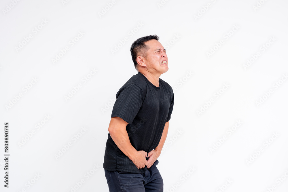 Middle-aged Asian man in discomfort holding his bladder isolated on white background Middle-aged Asian man in discomfort holding his bladder isolated on white background