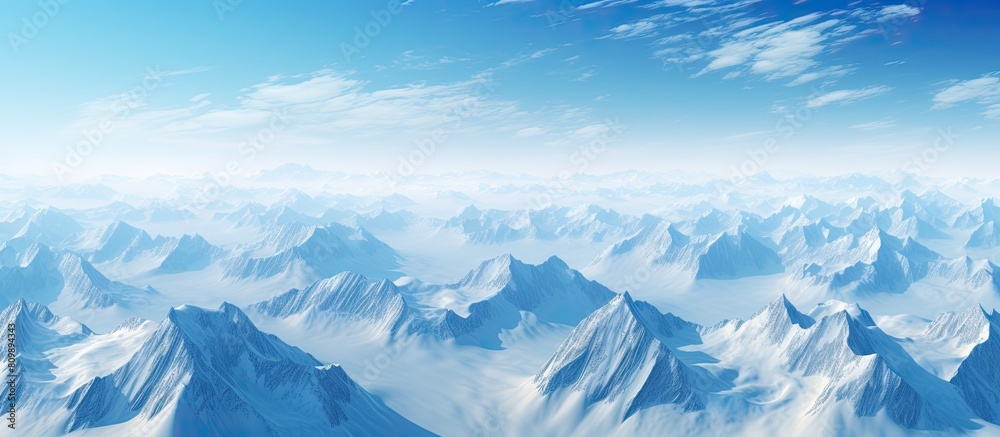 Fototapeta premium A breathtaking aerial perspective of Greenland reveals the majestic snow capped mountains offering an enchanting copy space image