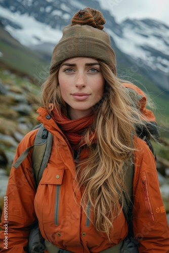 Woman wearing hiking attire in the rugged terrain of the Swiss Alps © BHPX