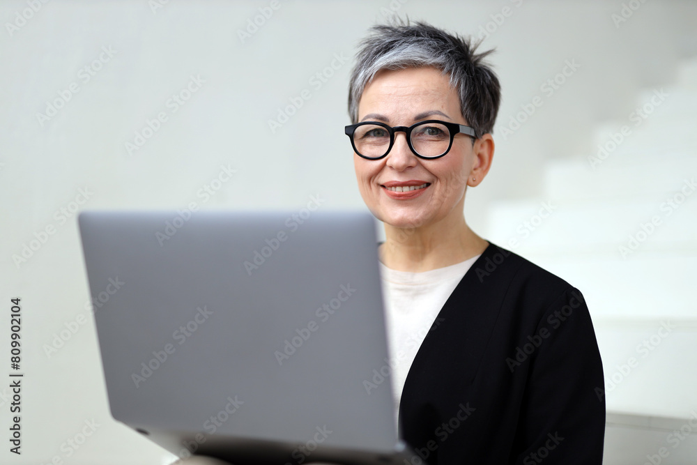 A successful businesswoman communicates effectively online, working from home with confidence and professionalism. A successful businesswoman communicates effectively online, working from home with confidence and professionalism.