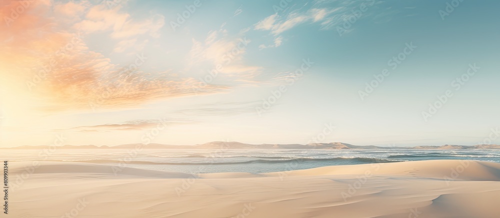 A peaceful and relaxing summer concept of a desert beach at sunset with a white sandy background and ample copy space for your image