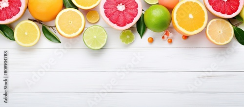 A variety of delicious pomelo fruits placed on a white wooden table captured in a flat lay copy space image