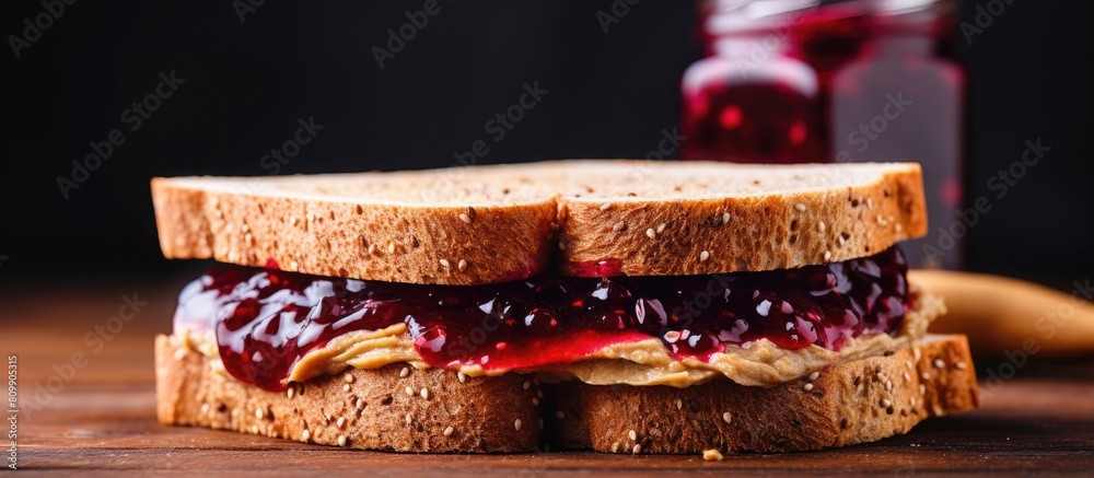 A breakfast sandwich made with toast sunflower seed paste instead of nut butter and vegan organic jam Represents a healthy and allergy friendly food option Copy space image A breakfast sandwich made with toast sunflower seed paste instead of nut butter and vegan organic jam Represents a healthy and allergy friendly food option Copy space image
