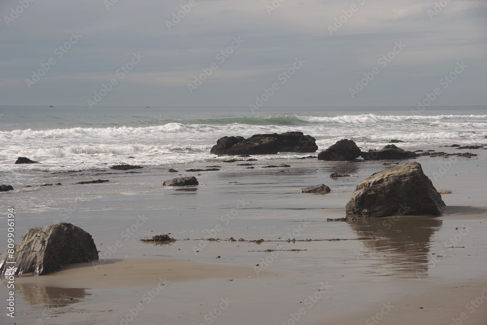 Low tide revealing underwater rocks at a California beach Low tide revealing underwater rocks at a California beach