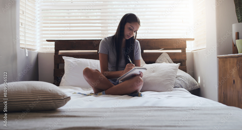 Girl, and journal by writing on bed in notebook for letter, planning and study in home. Female person, creative and reading for self improvement, education and diary for reflection or development Girl, and journal by writing on bed in notebook for letter, planning and study in home. Female person, creative and reading for self improvement, education and diary for reflection or development