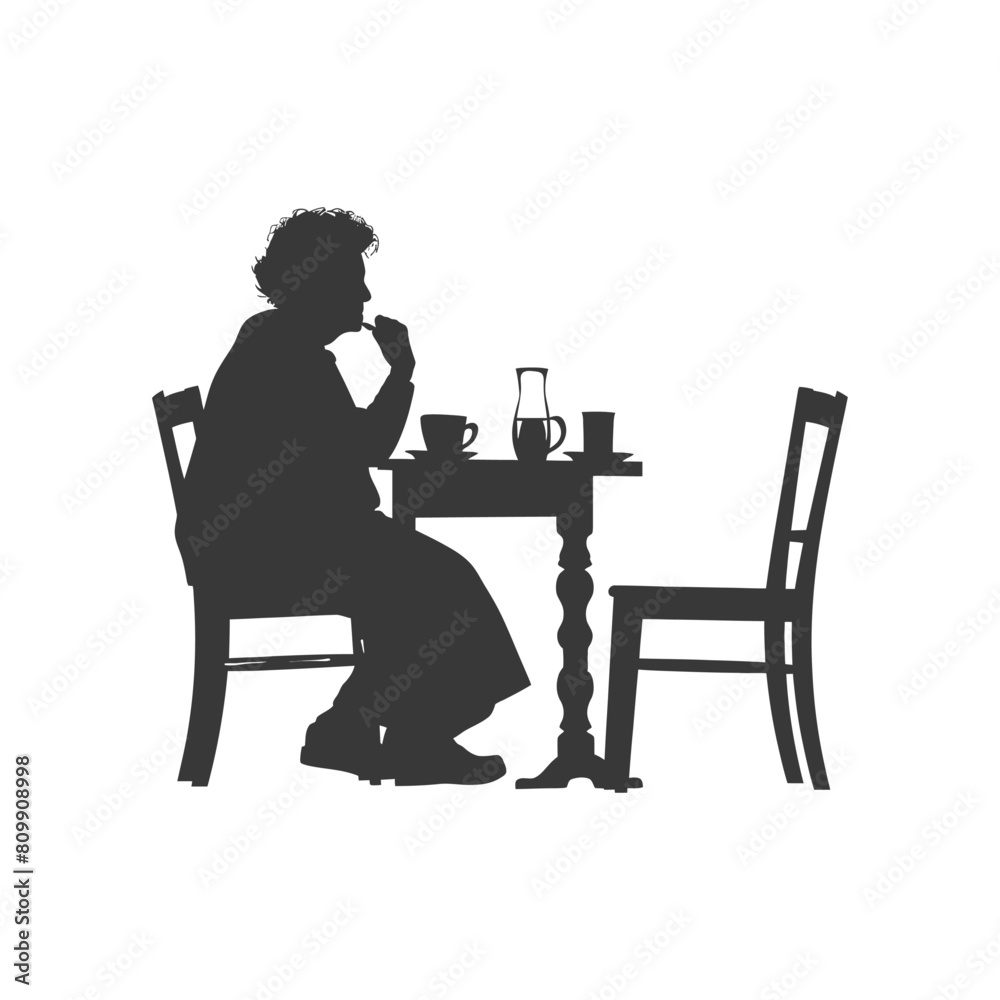 Silhouette elderly woman sitting at a table in the cafe Silhouette elderly woman sitting at a table in the cafe