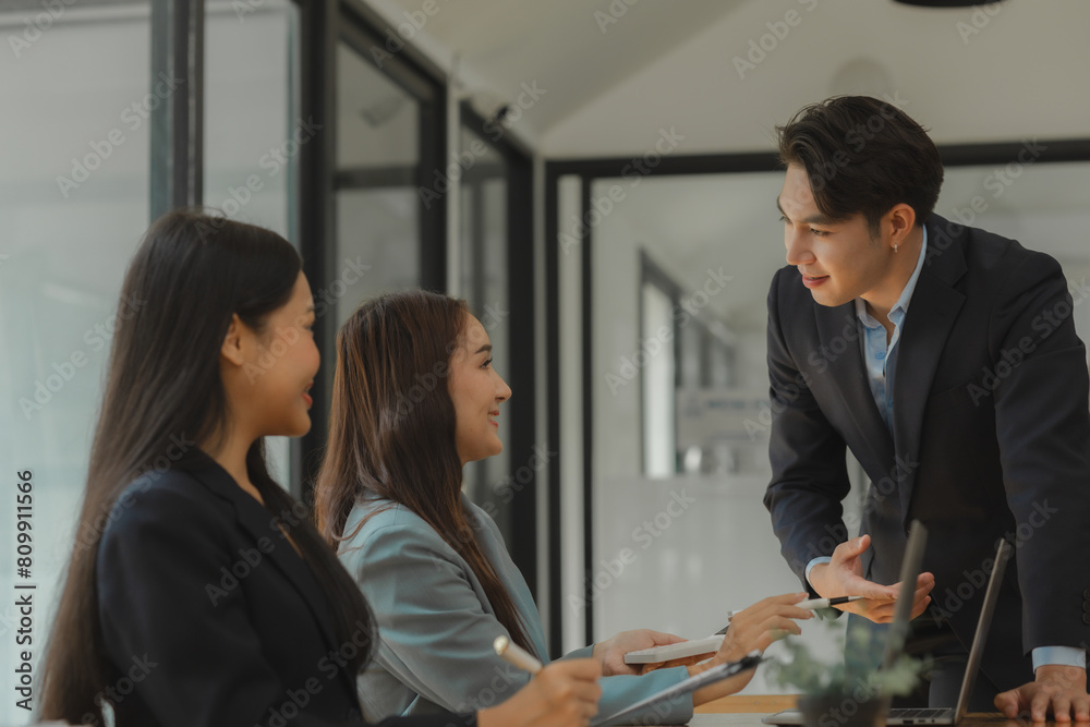 Fototapeta premium employees are discussing and exchange their idea to solve some miner problem, group of entrepreneurs is planning strategy to increase their income in the office, happy working