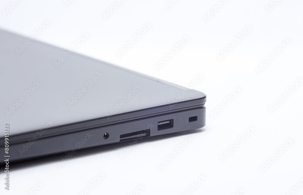 Closed black laptop closeup on white background Closed black laptop closeup on white background